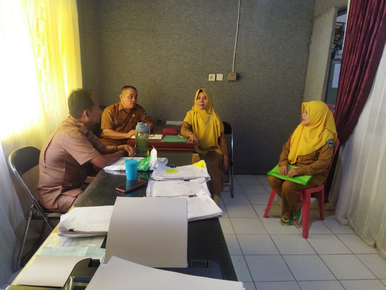Koordinasi serta mengantar laporan ke Kantor Dinas Arsip